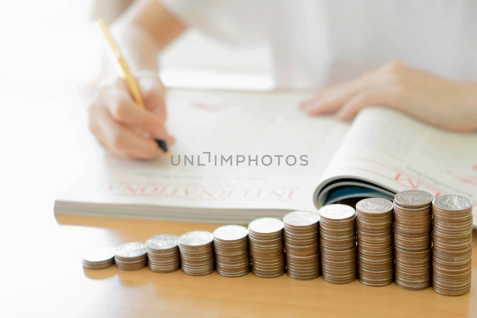 Woman writing on paper by ekachailo