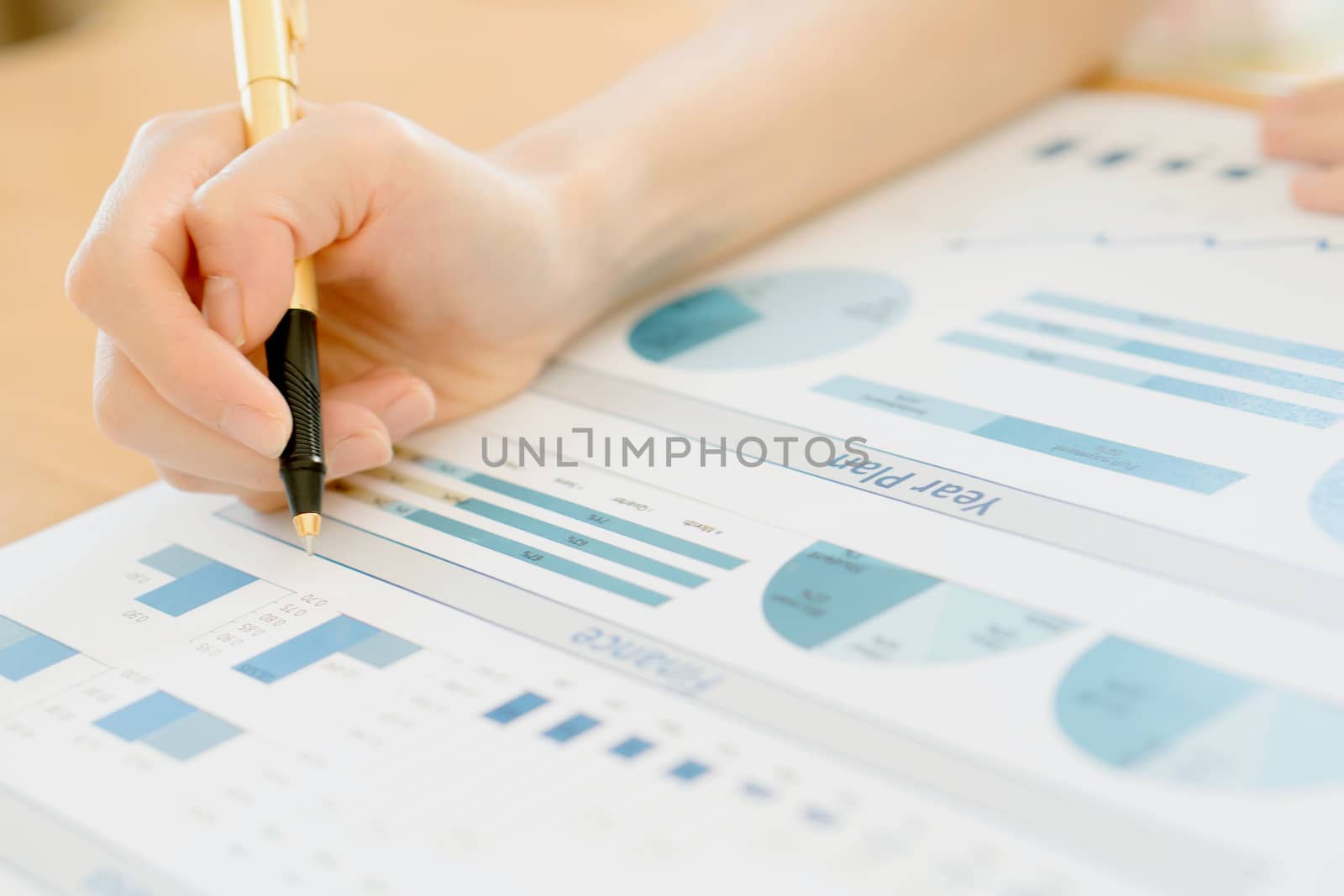 Businesswoman Analyzing Financial Graph With Coins 