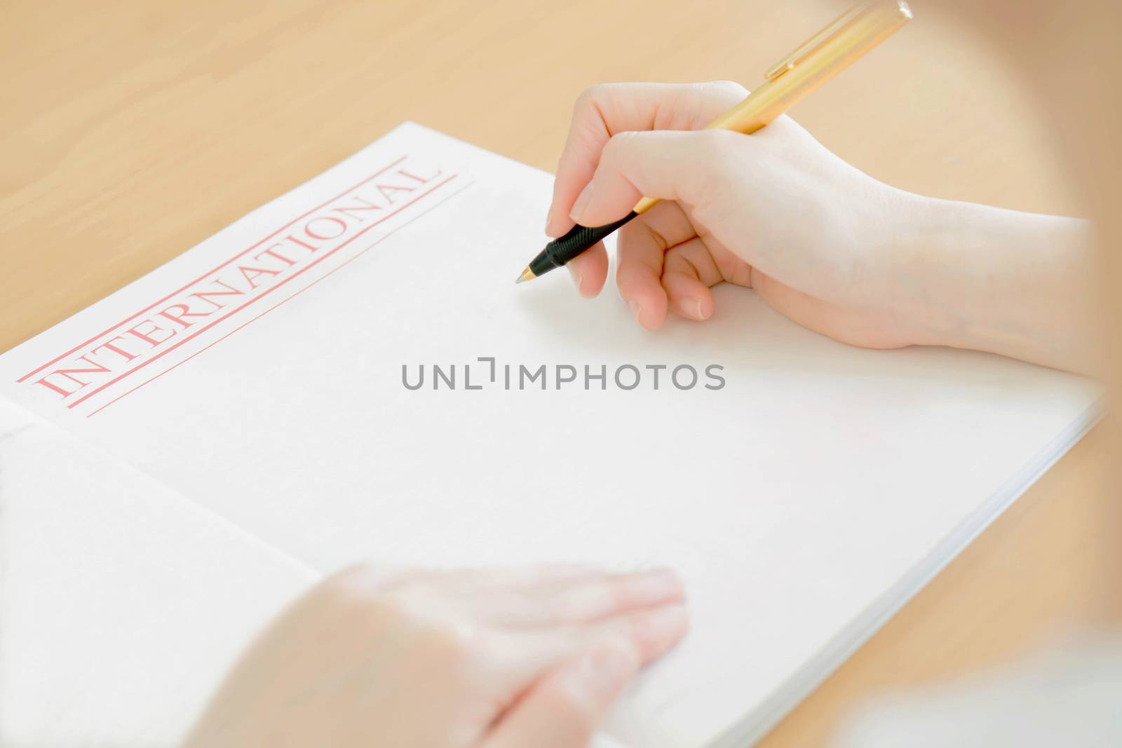 Woman writing on paper