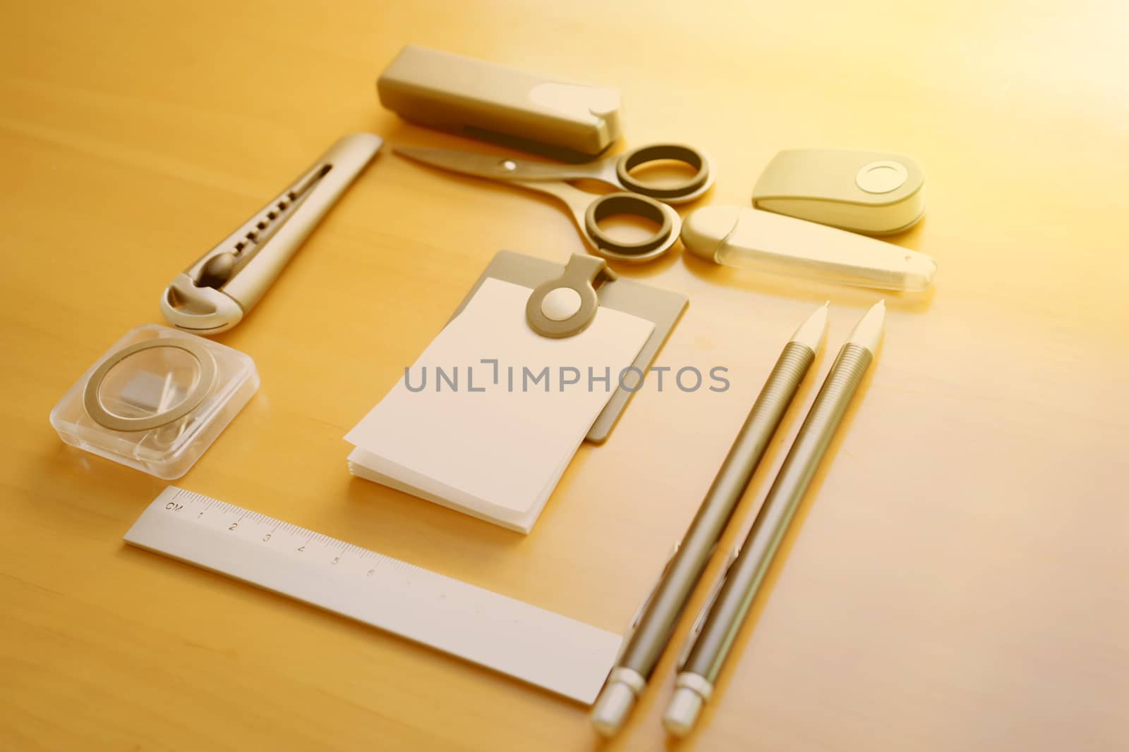 Open album with school supplies on the wooden table