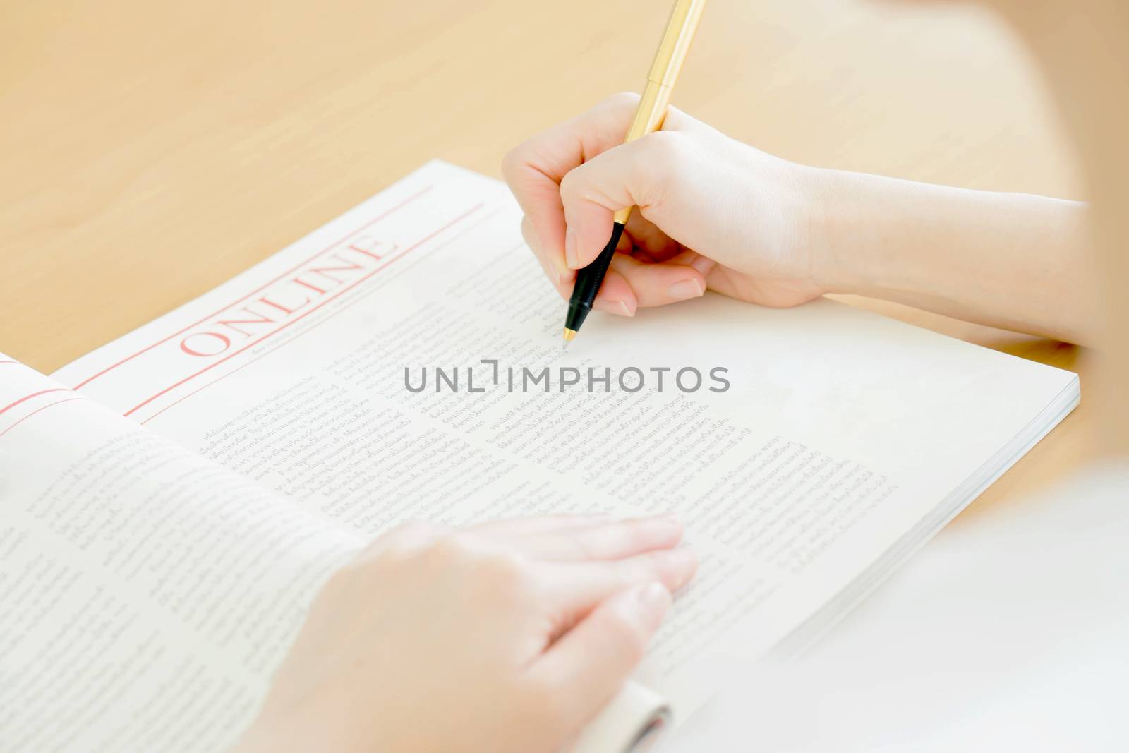 Woman writing on paper