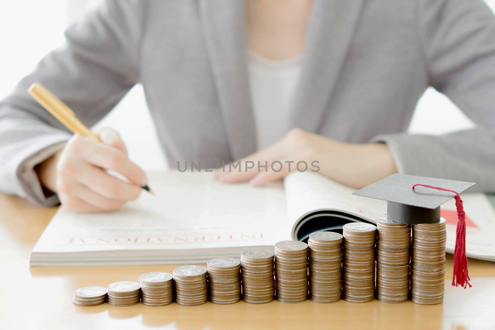 Woman writing on paper by ekachailo