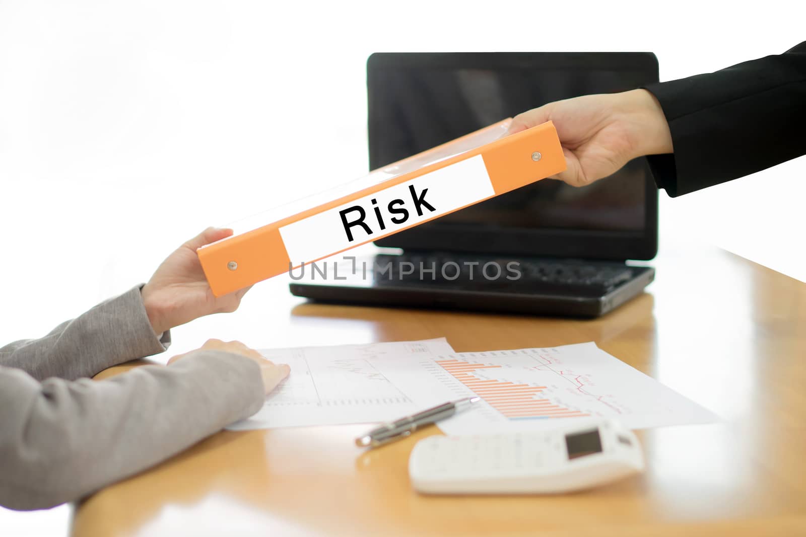 Businesswoman sends the debtor document to the businessman. selective focus.