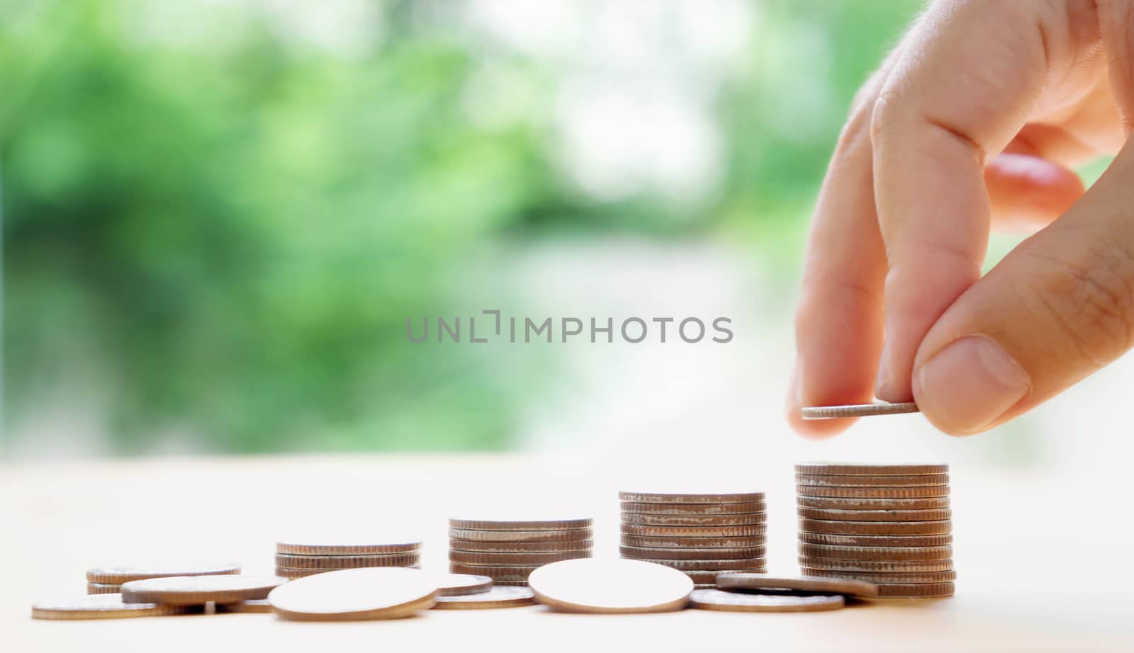 hand put money coins to stack of coins. Money, Financial, Busine by ekachailo