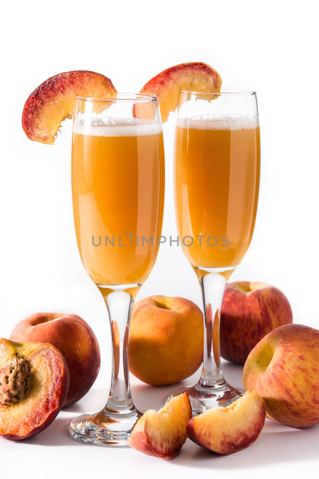 Bellini champagne cocktail in crystal glass isolated on white background