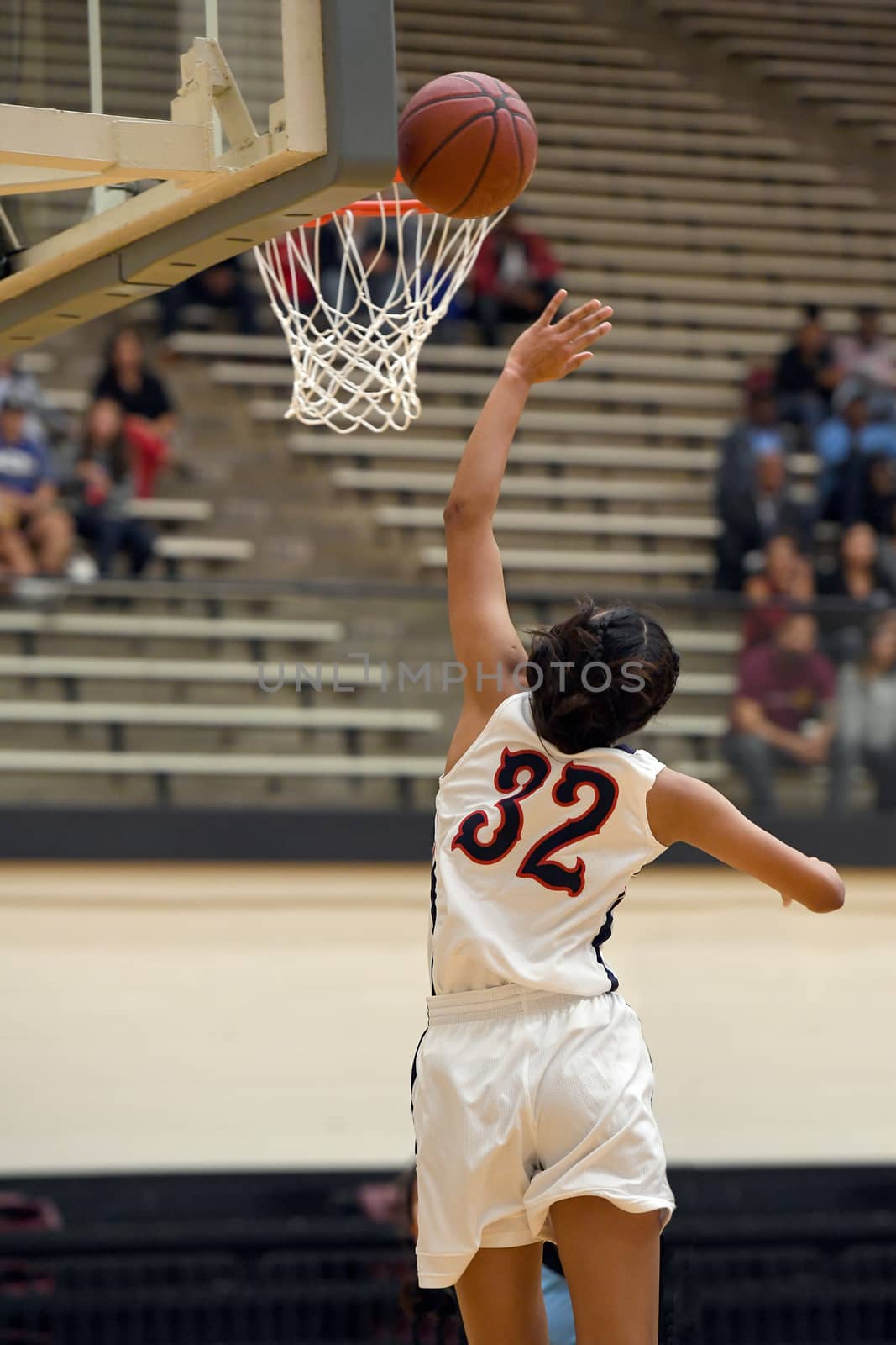 Girl shooting a basketball lay up with the caption: "My Game"