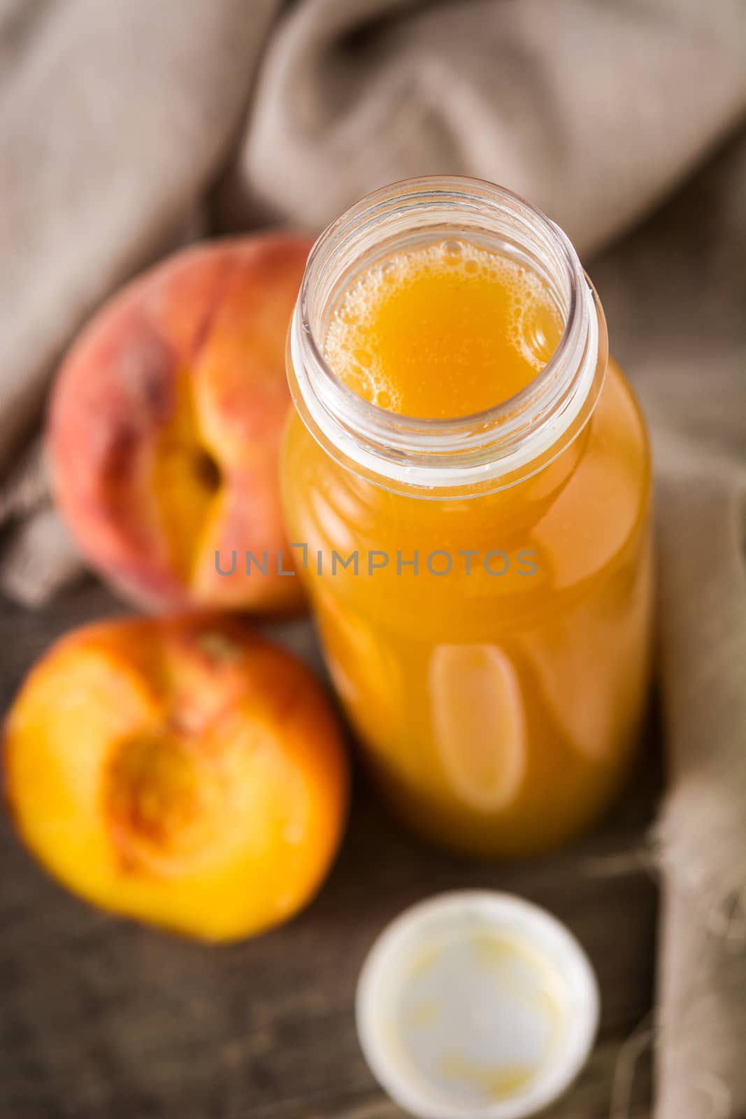 Peach juice in glass isolated on white background