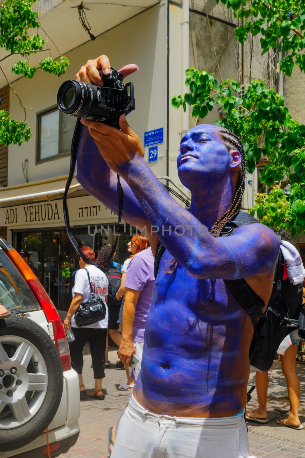 TEL-AVIV, ISRAEL - JUNE 03, 2016: A participant in the Pride Parade takes photos, in Tel-Aviv, Israel. Its part of an annual event of the LGBT community