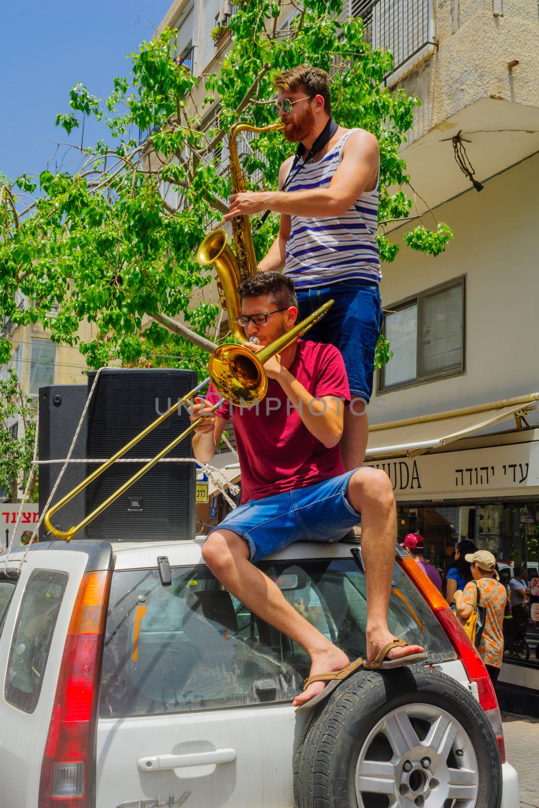 TEL-AVIV, ISRAEL - JUNE 03, 2016: People play music, as part of the Pride Parade in the streets of Tel-Aviv, Israel. Its part of an annual event of the LGBT community