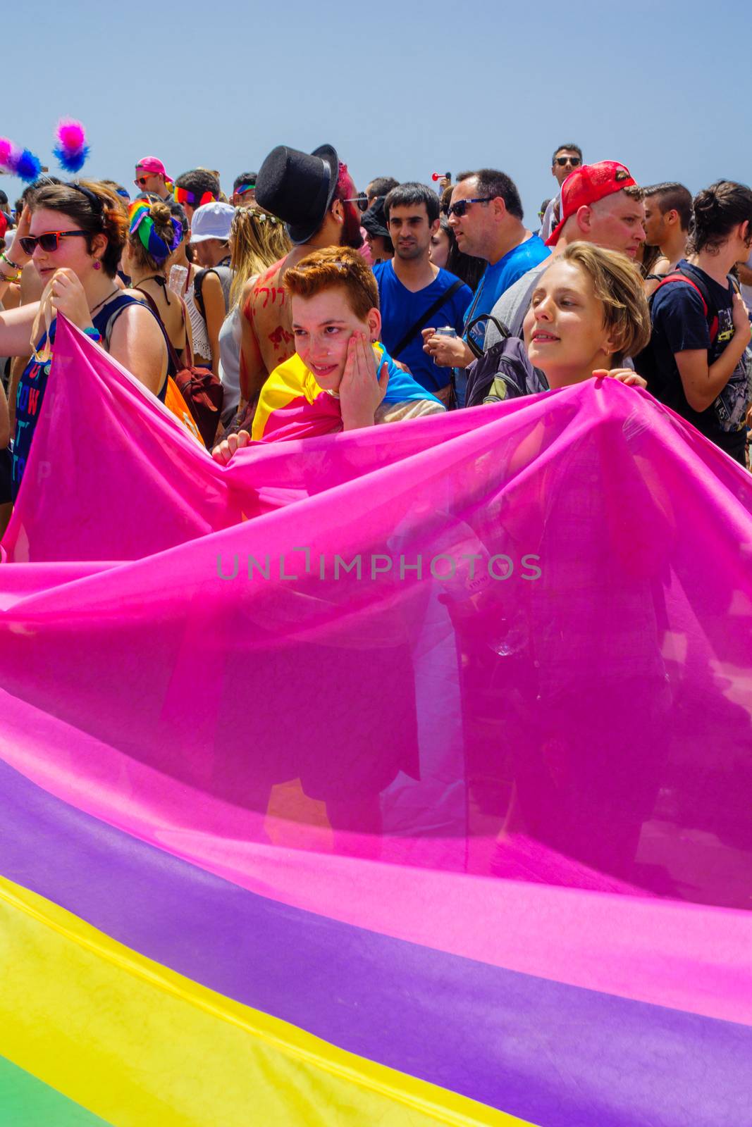 TEL-AVIV, ISRAEL - JUNE 03, 2016: A crowd of people march in the Pride Parade in the streets of Tel-Aviv, Israel. Its part of an annual event of the LGBT community