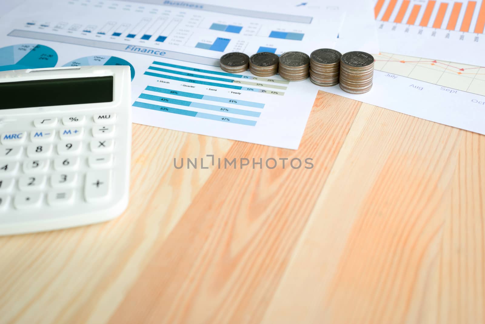 Business concept with calculator and coins  by ekachailo