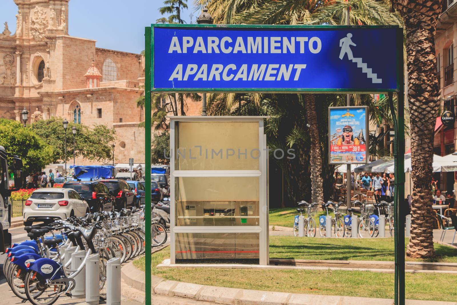 VALENCIA, SPAIN - June 16, 2017 : near a bike station for rent a blue sign or it is written in Spanish and Catalan - parking