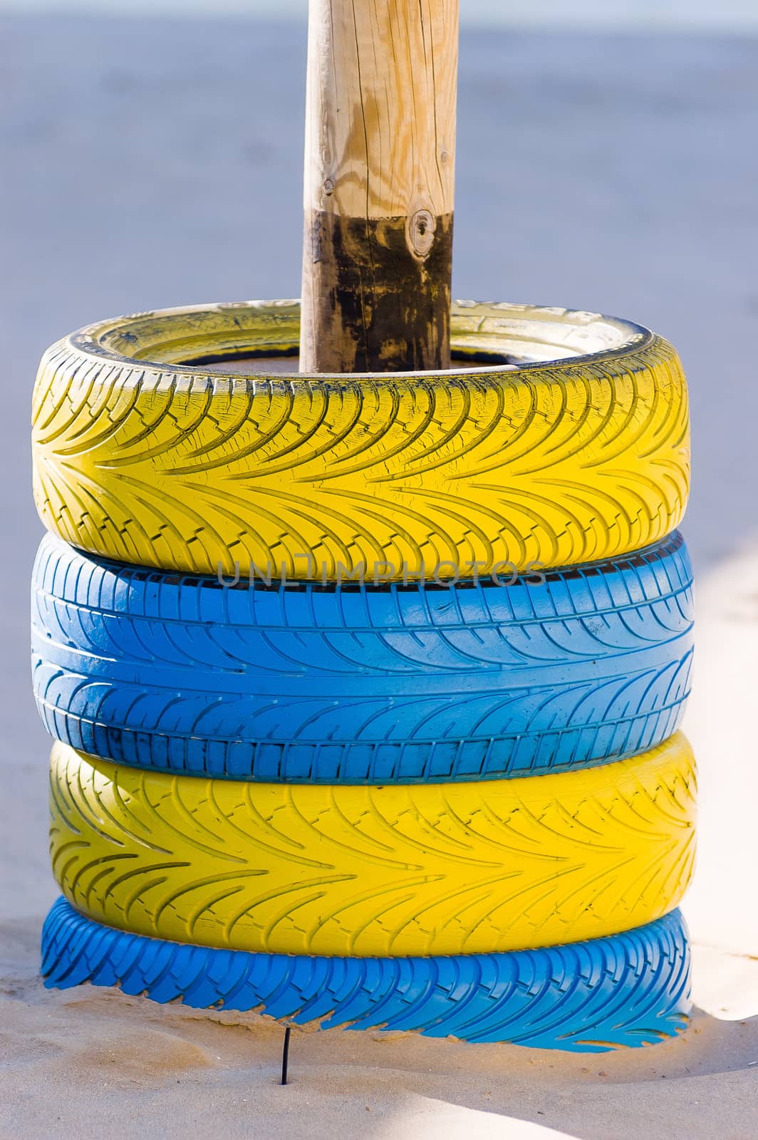 Four blue and yellow tires