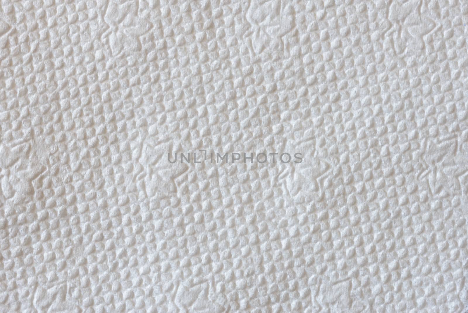 Macro of a white embossed paper napkin texture