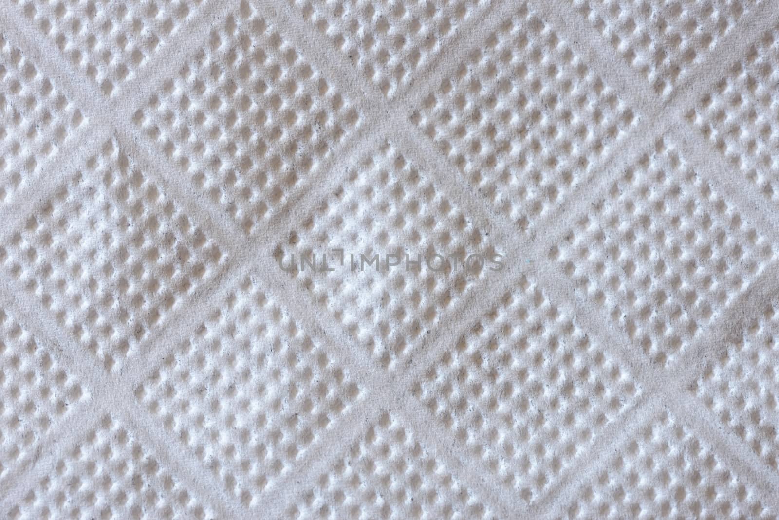 Macro of a white embossed paper napkin texture