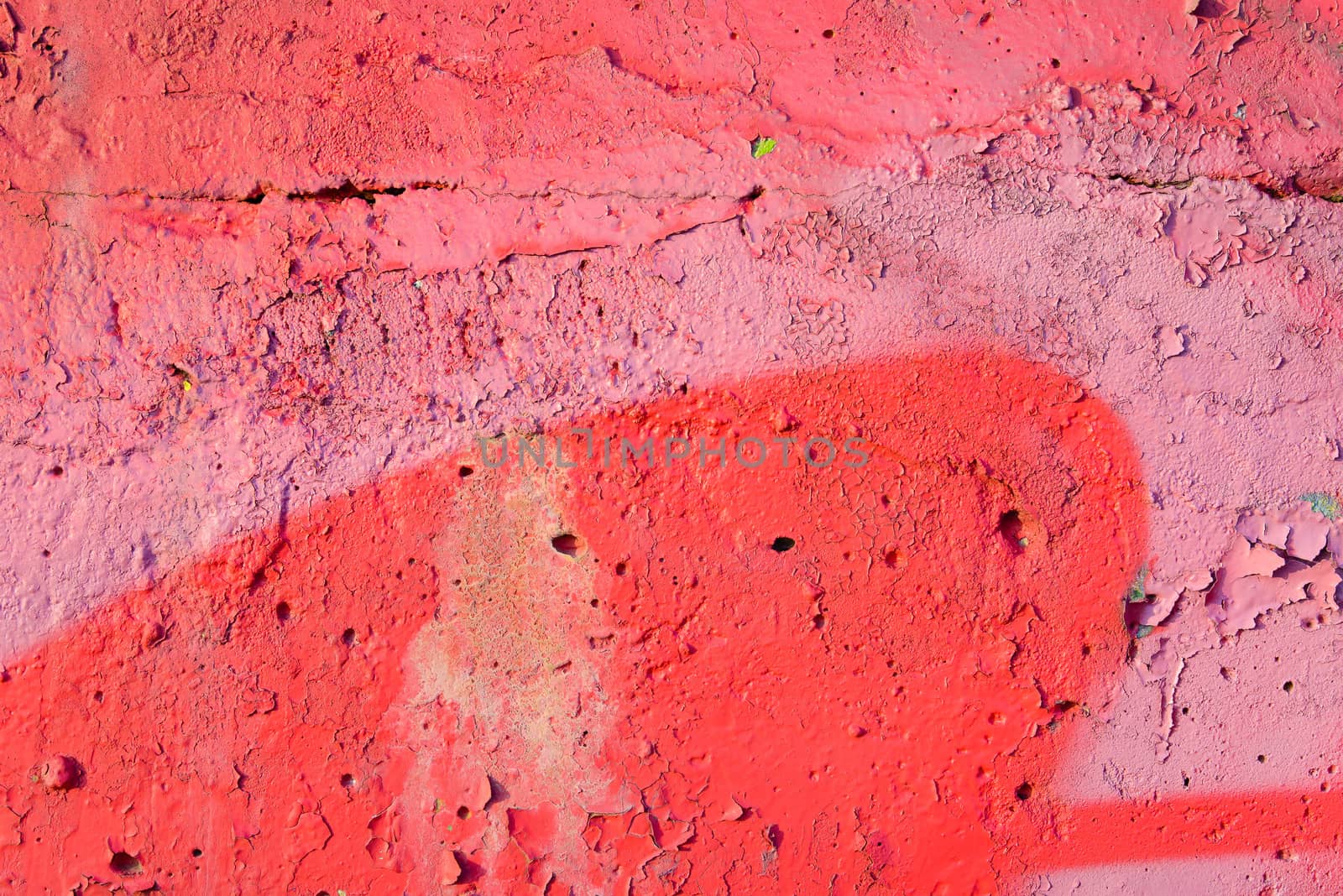 Red and pink colored texture wall with cracks
