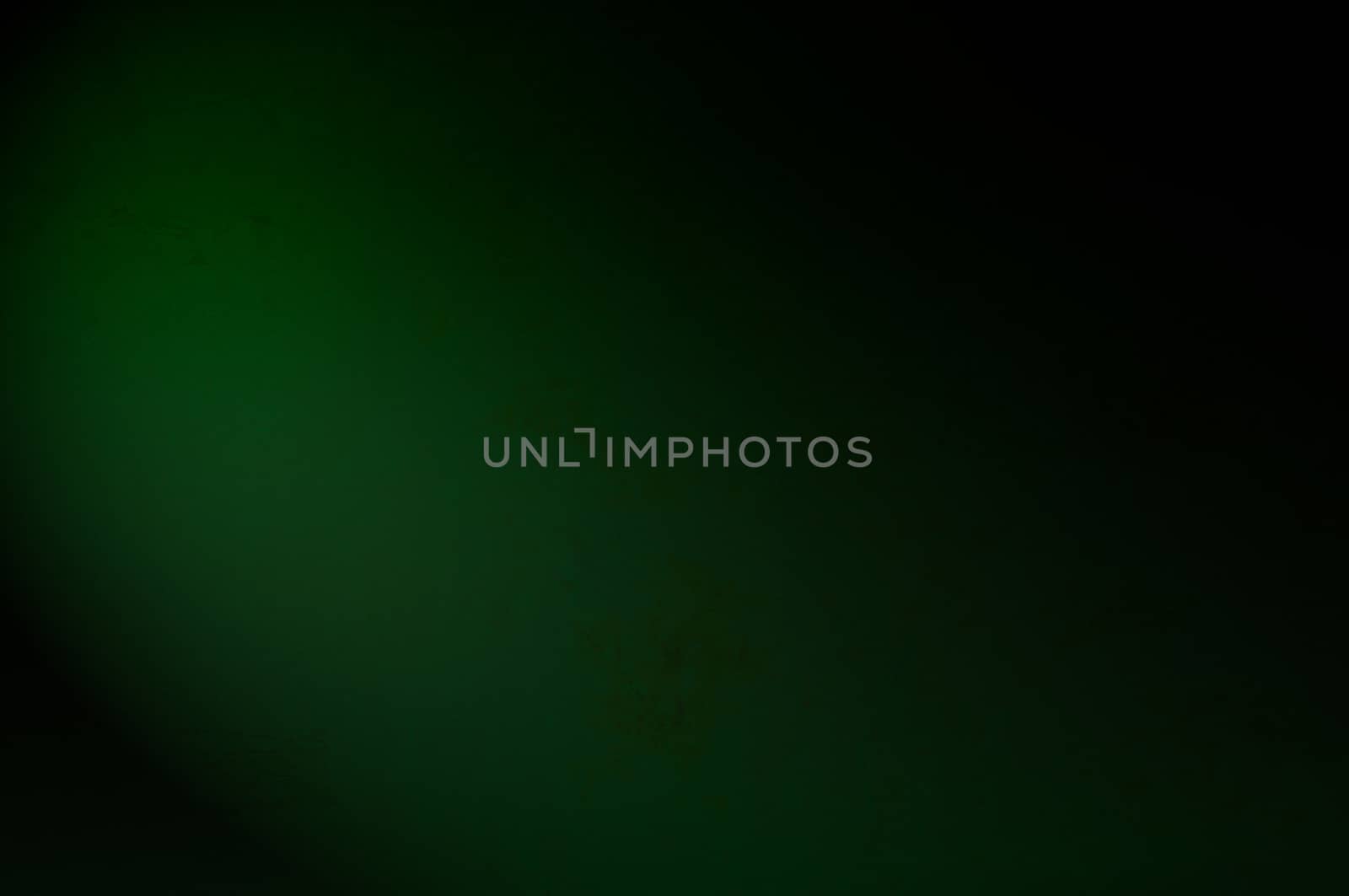 An antique green texture with light effect, to be used as background with images or light colored text.