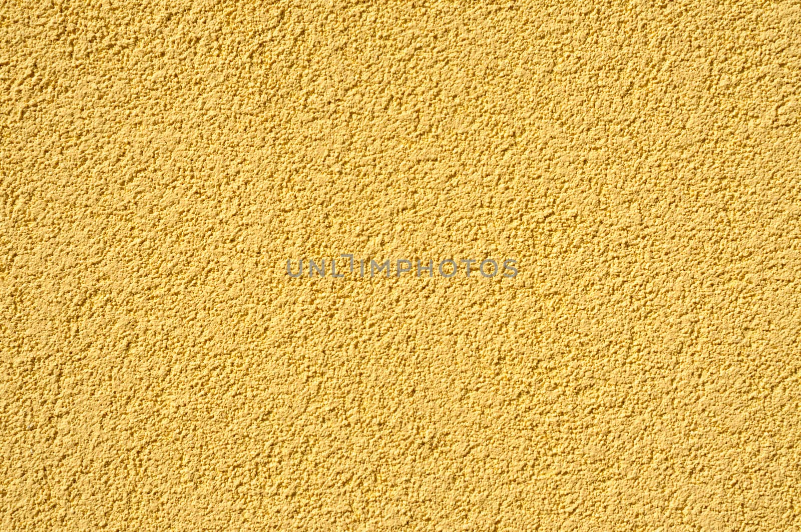 A yellow cement - stucco modern wall texture