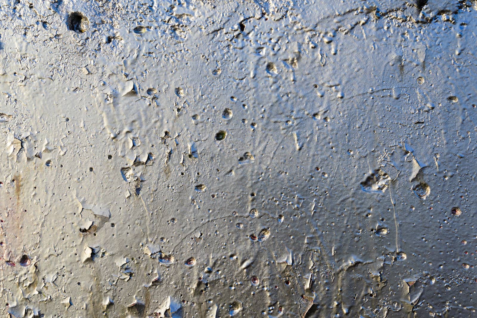 Wall with Silver Paint Texture with yellow and blue reflection