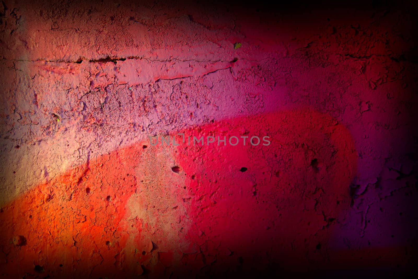 Red and pink colored texture wall with cracks