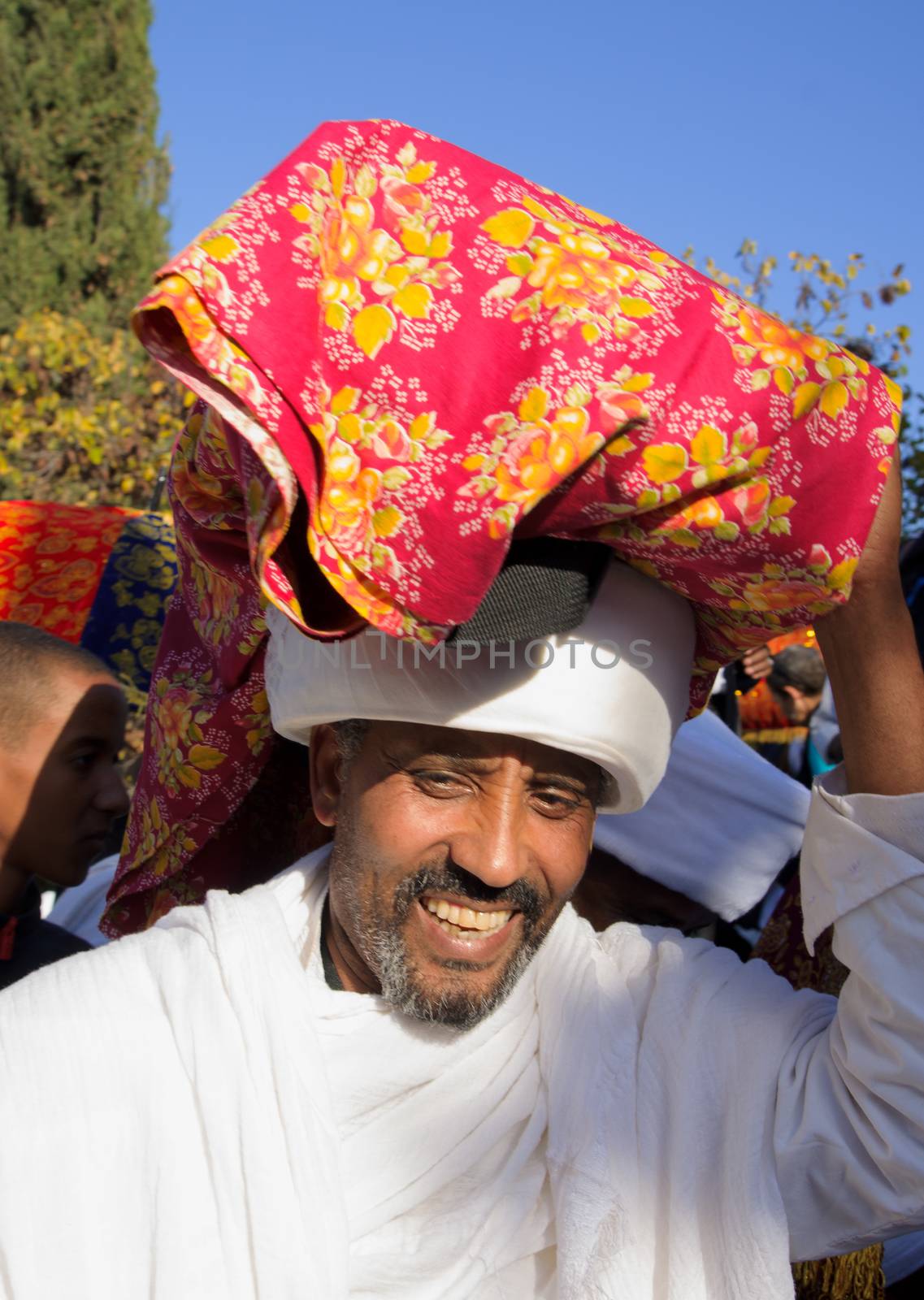 JERUSALEM - NOV 20, 2014: A Kes, religious leader of the Ethiopian Jews, carrying a wrapped holy prayer book, at the end of the annual Sigd holiday prays, in Jerusalem, Israel