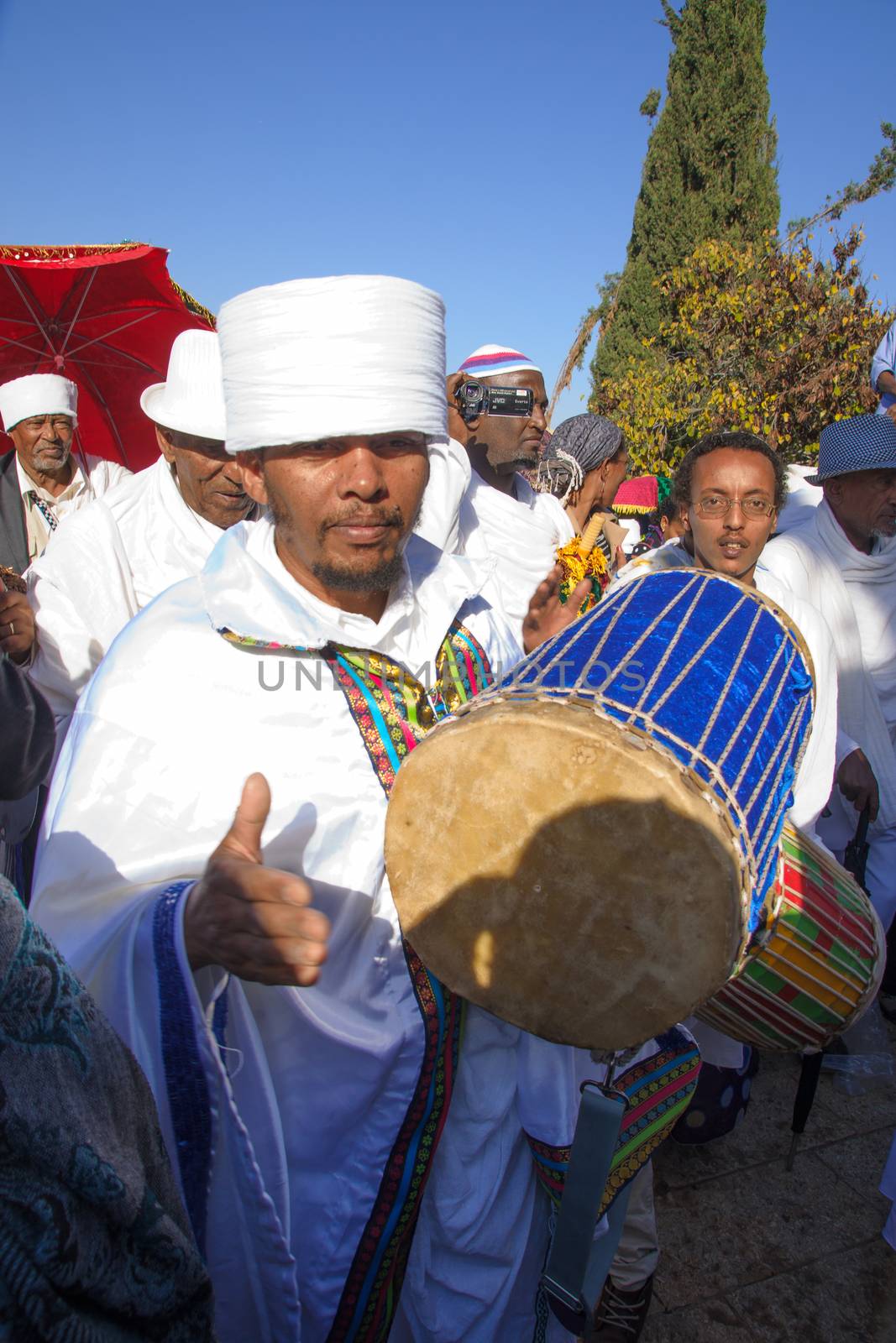 JERUSALEM - NOV 20, 2014: A Kes, religious leader of the Ethiopian Jews, plays a drum to mark the end of the Sigd prays, in Jerusalem, Israel. The Sigd is an annual holiday of the Ethiopian Jews