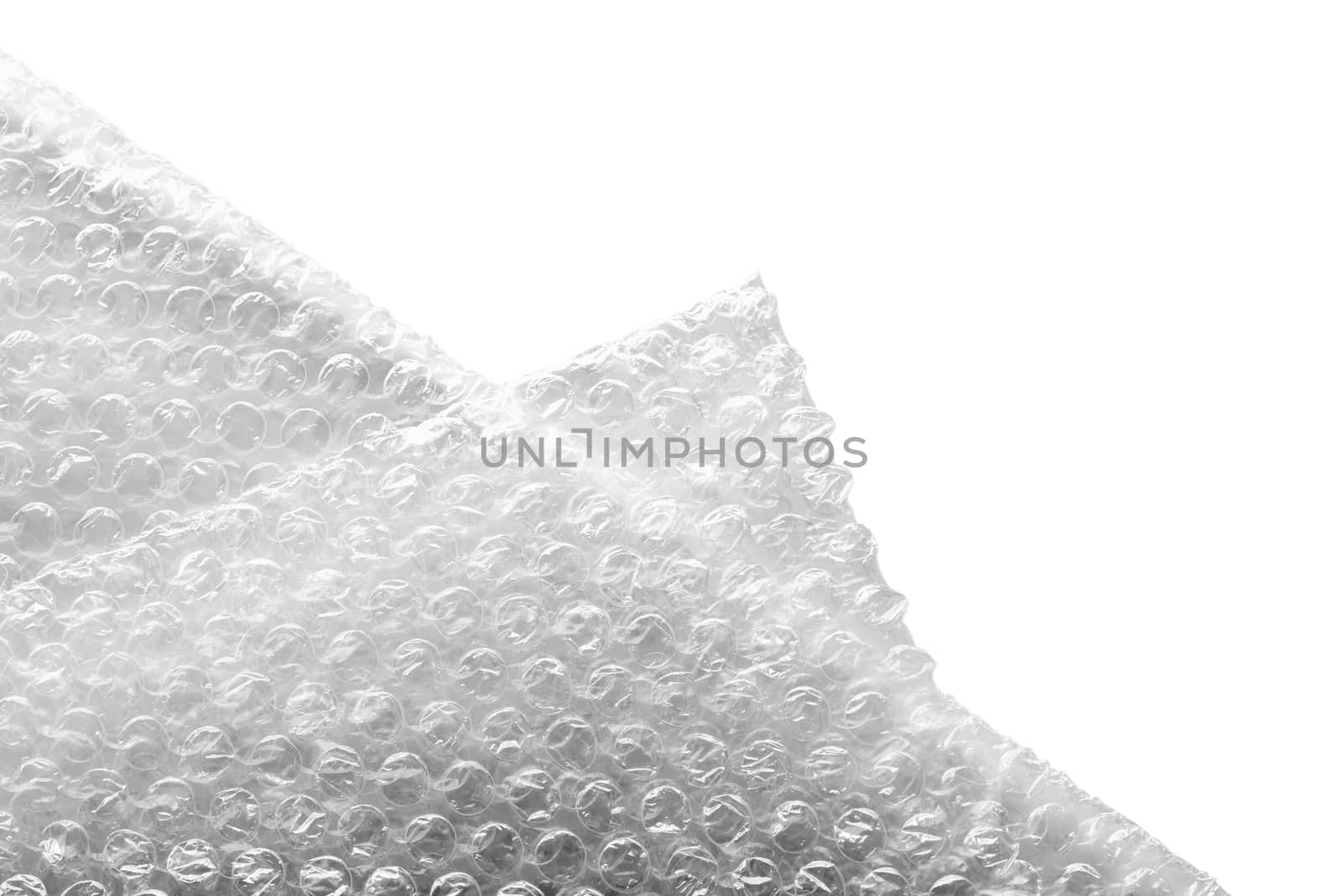 Bubble wrap material for a safety packing, isolated on white background. Abstract texture.