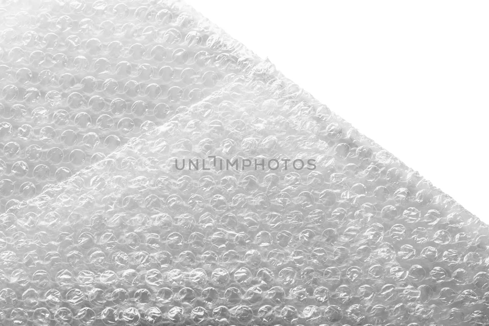 Bubble wrap material for a safety packing, isolated on white background. Abstract texture.