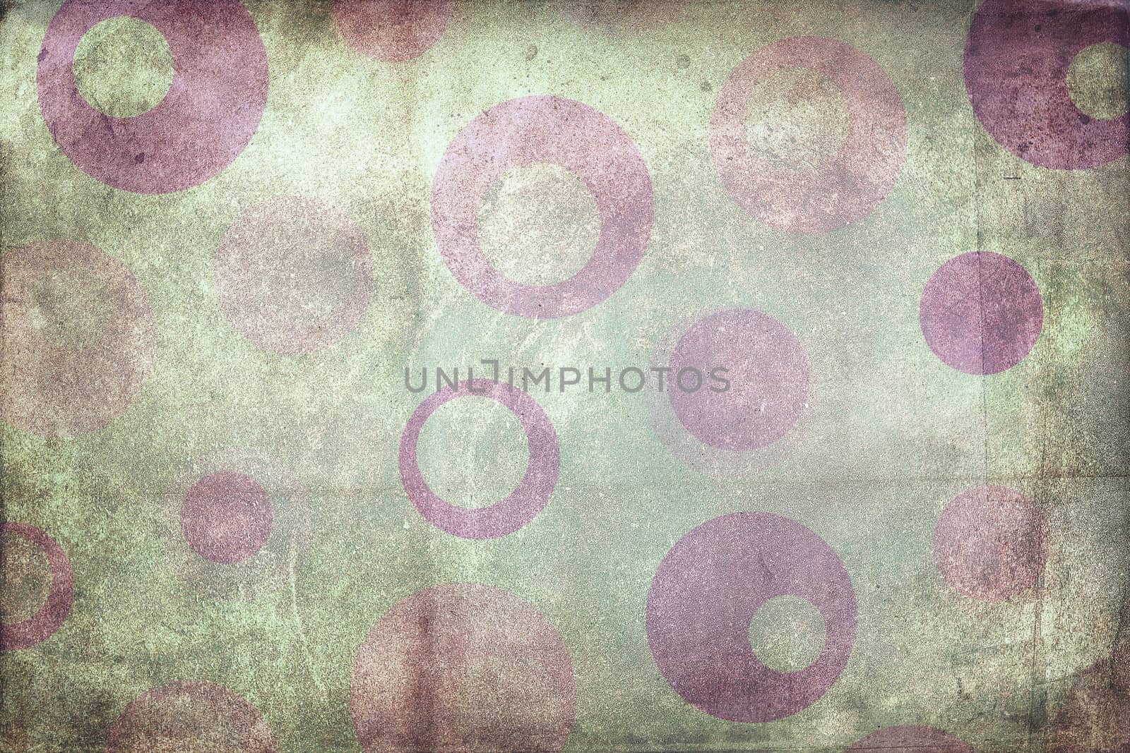 Texture background made of  purple dots, or circles, on green