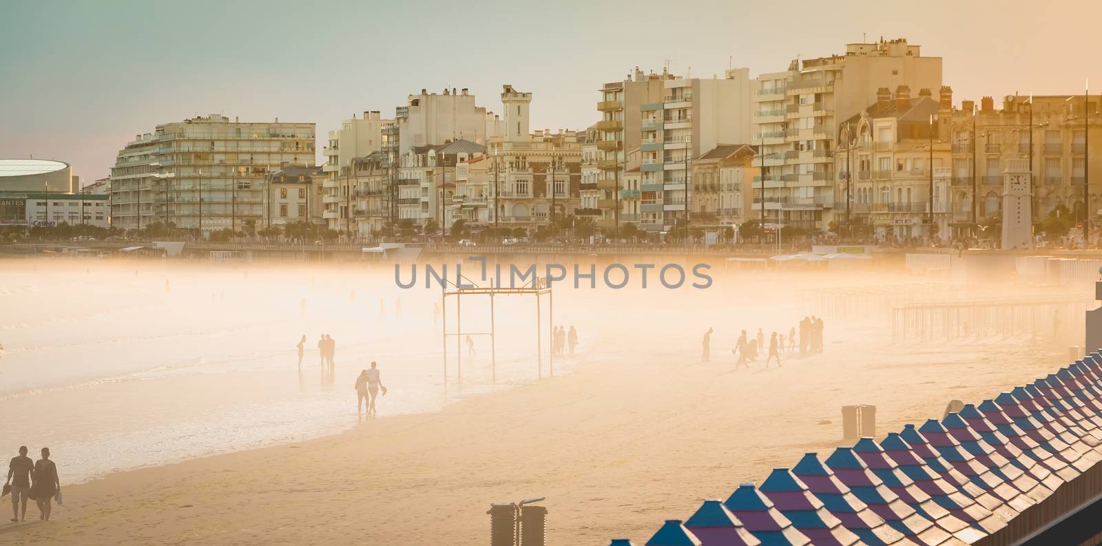 LES SABLES D OLONNE, FRANCE - June 22, 2016 : people walk on sand at the seaside on a summer day