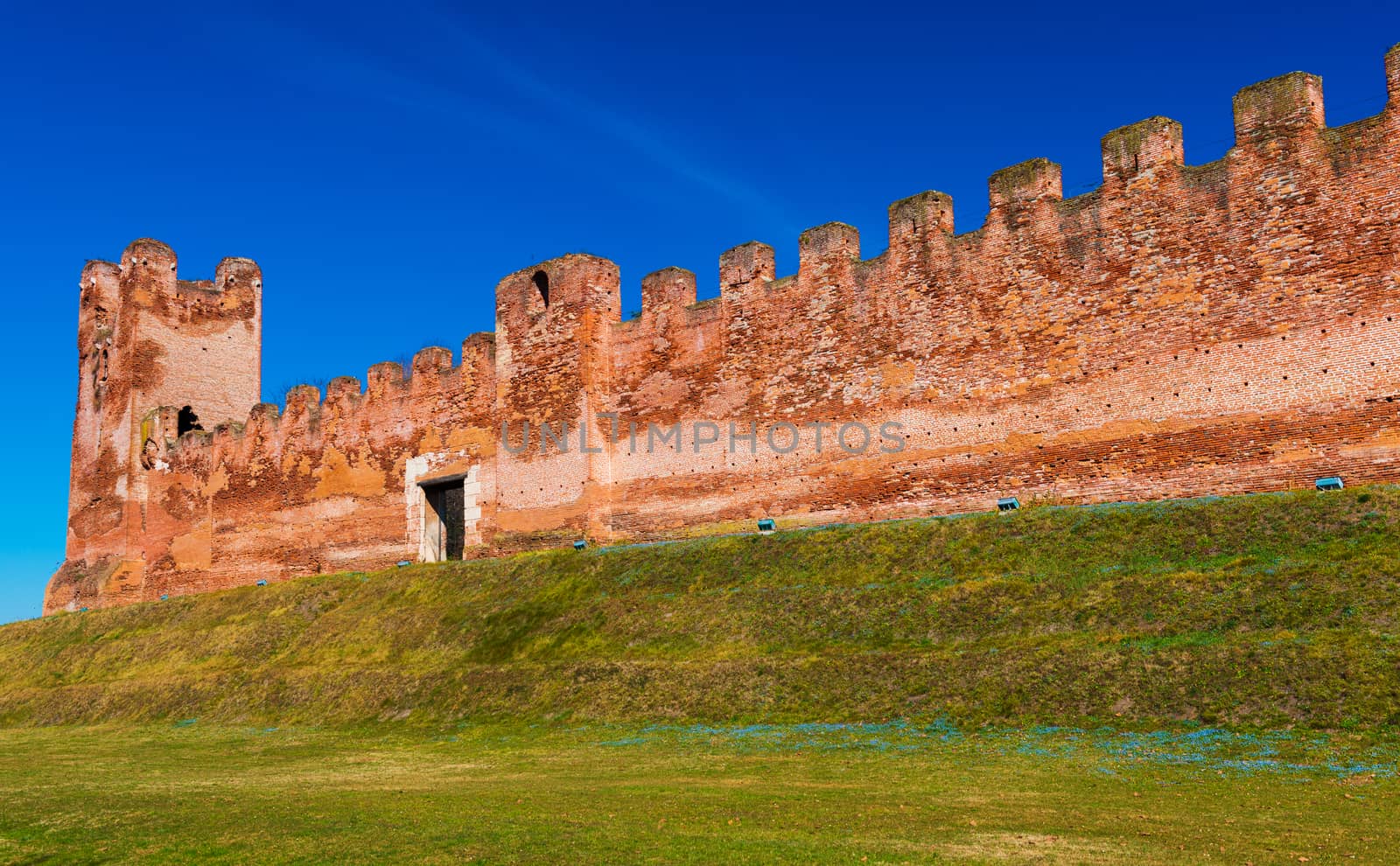 Walled city of Castelfranco Vento, small medieval city in Northern Italy, red brick wall with watchtower