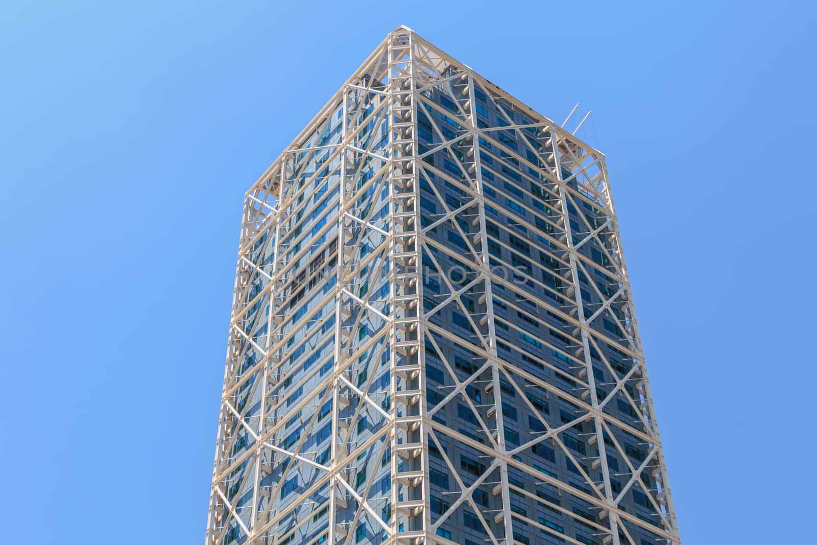 BARCELONA, SPAIN - June 21, 2017 : architectural detail of the Hotel Arts tower during the summer, a skyscraper designed by the American architect Bruce Graham and built for the 1992 Summer Olympics