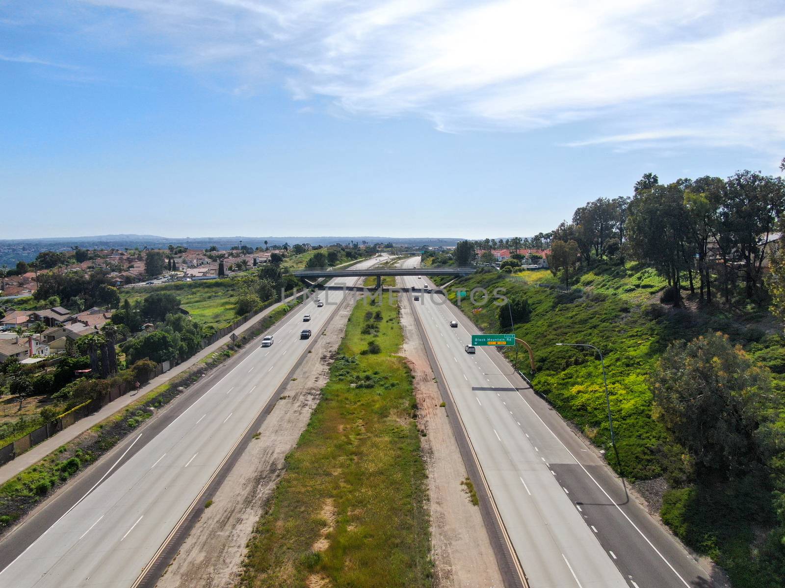 Aerial view of highway, freeway road with vehicle in movement by Bonandbon