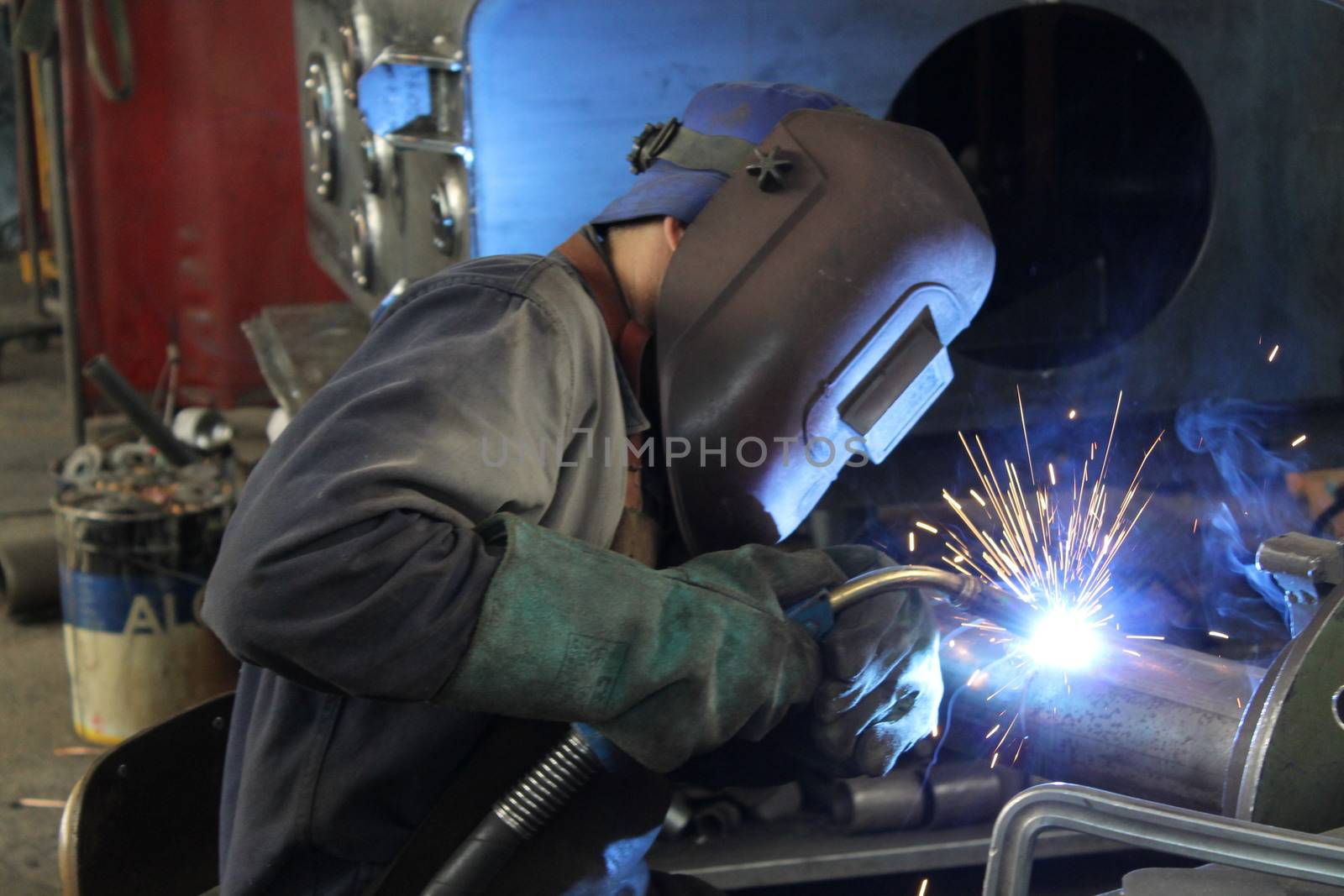 Welder performs welding work semi-automatic electric arc welding. MIG welding.