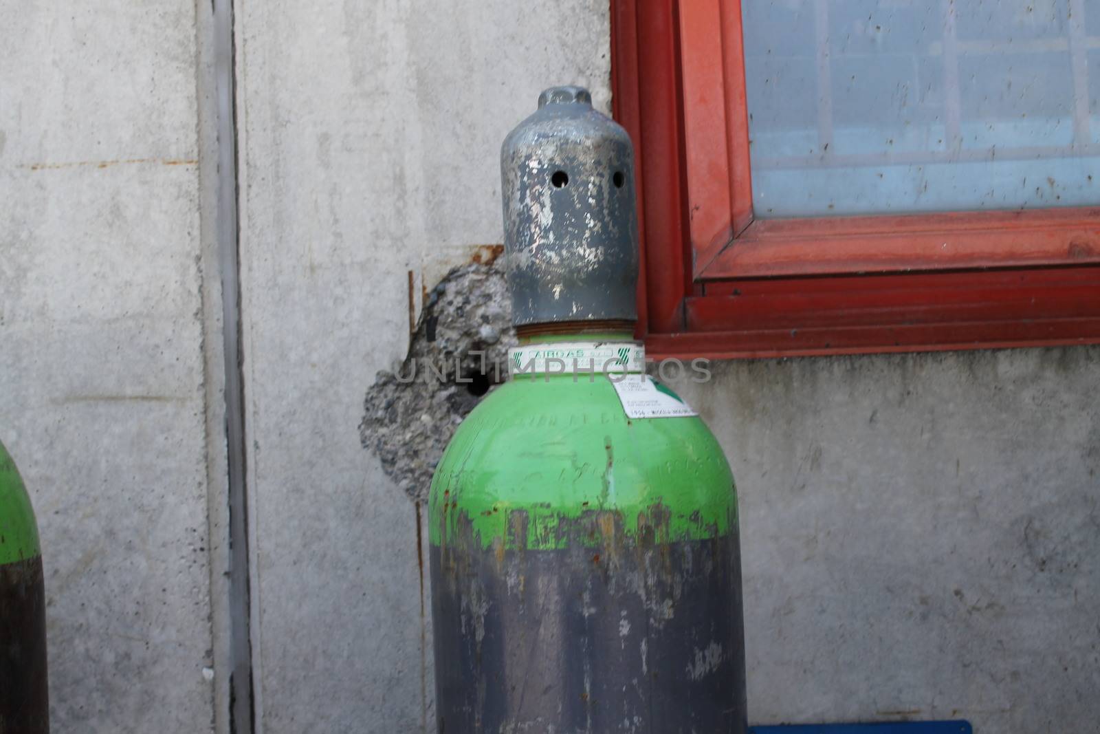 Gas cylinder for welder placed at the construction site.