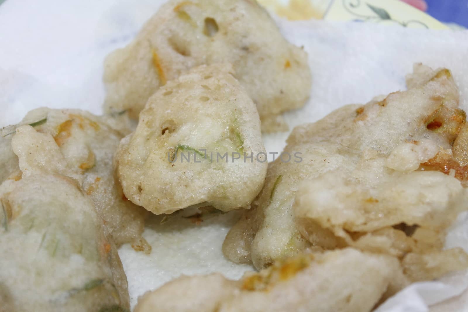 zucchini flowers in batter with mozzarella and anchovies