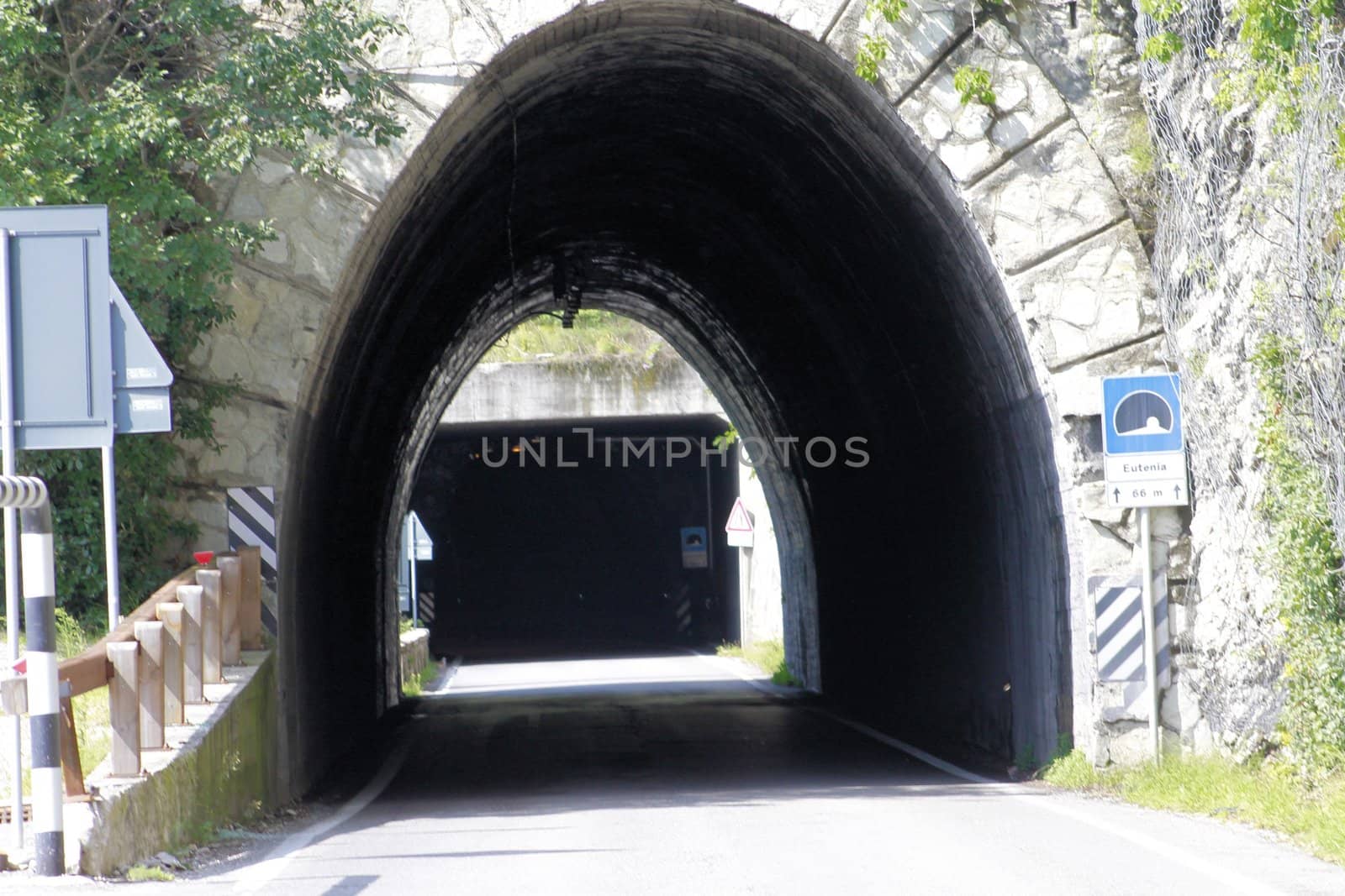 Scenic panoramic beltway road around lake Garda full of tunnels and galleries made in the rocks at the edge of a coastline