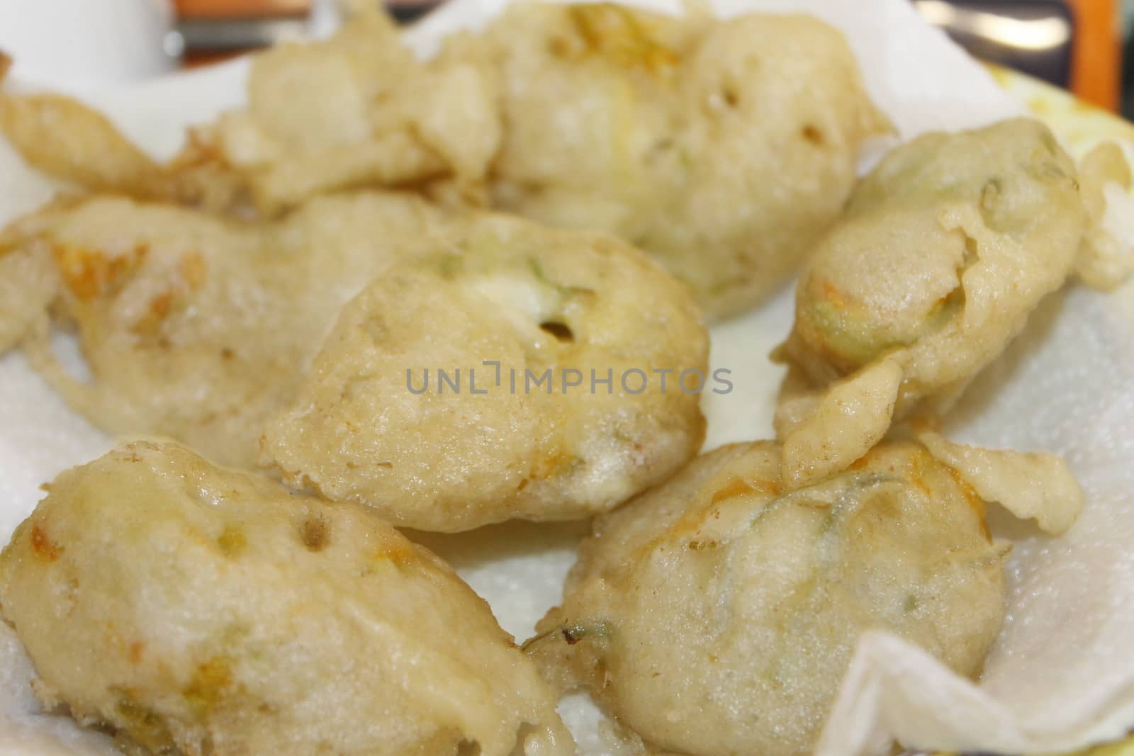 zucchini flowers in batter with mozzarella and anchovies