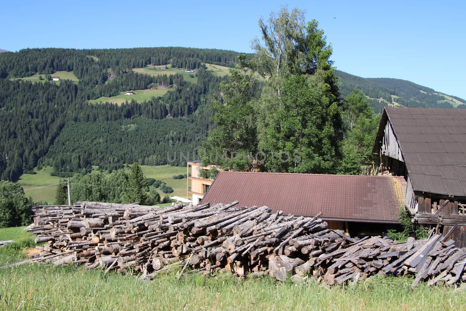 Pretty log cabin in the mountains during the autumn season