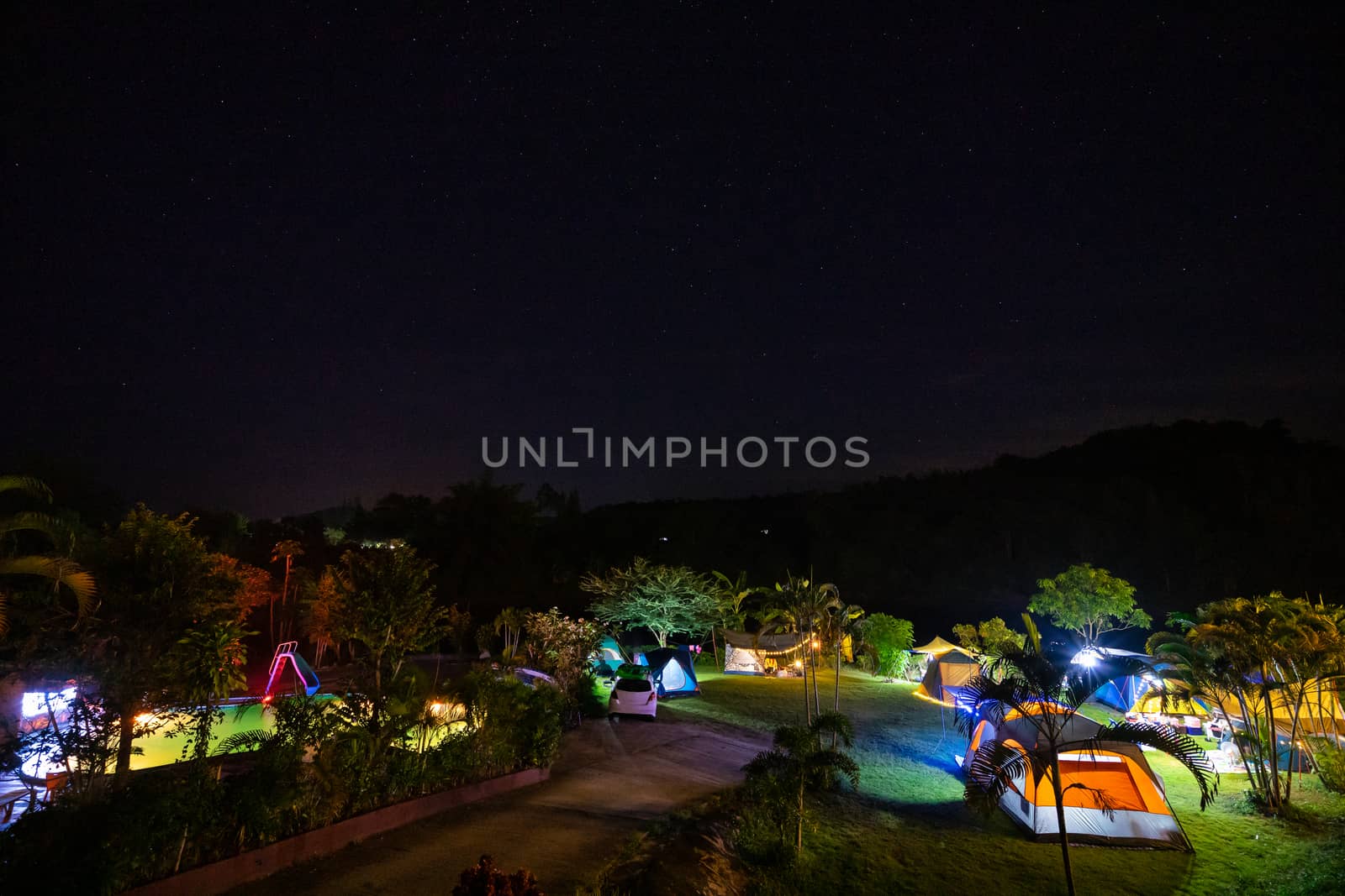 Camping and tent in nature park at night