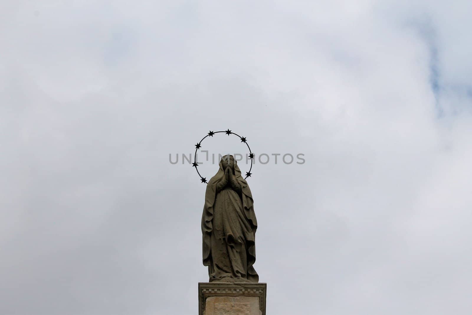 Golden Statue at Top of Church in Bergamo Italy