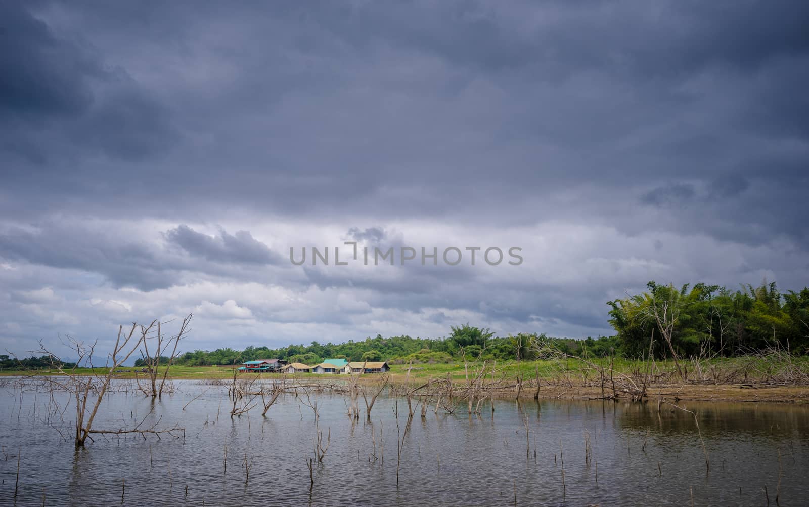 countryside near the lake with raincloud