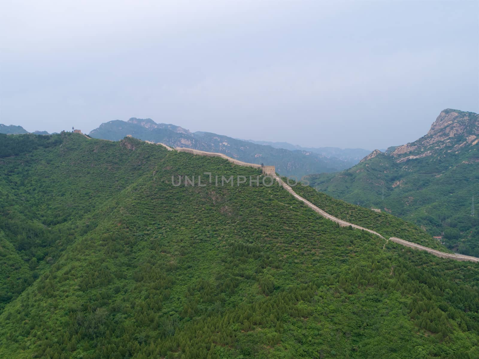 Aerial view of Great Wall of China. Famous landmark Great Wall and mountains by Bonandbon