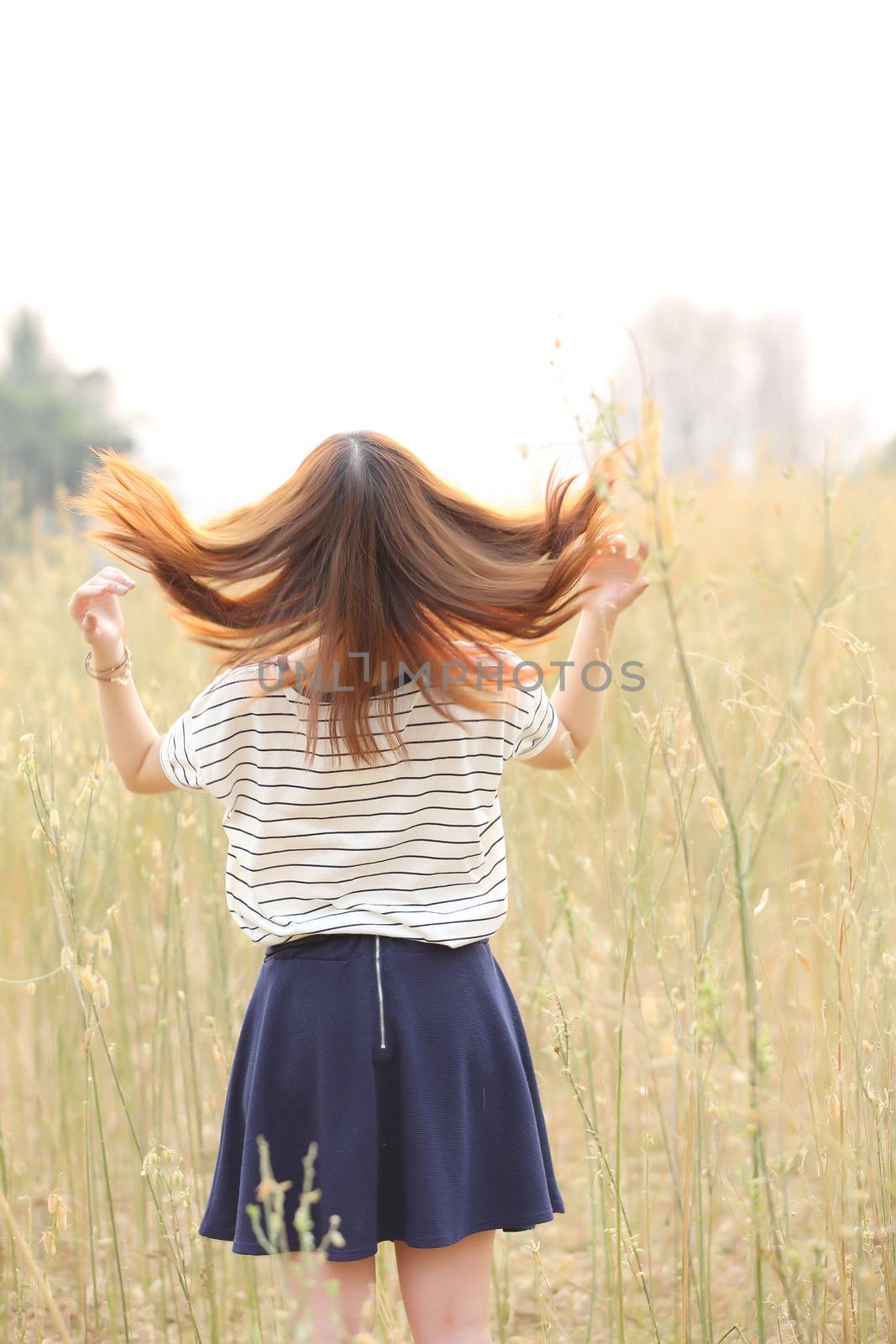 Young woman in wheat