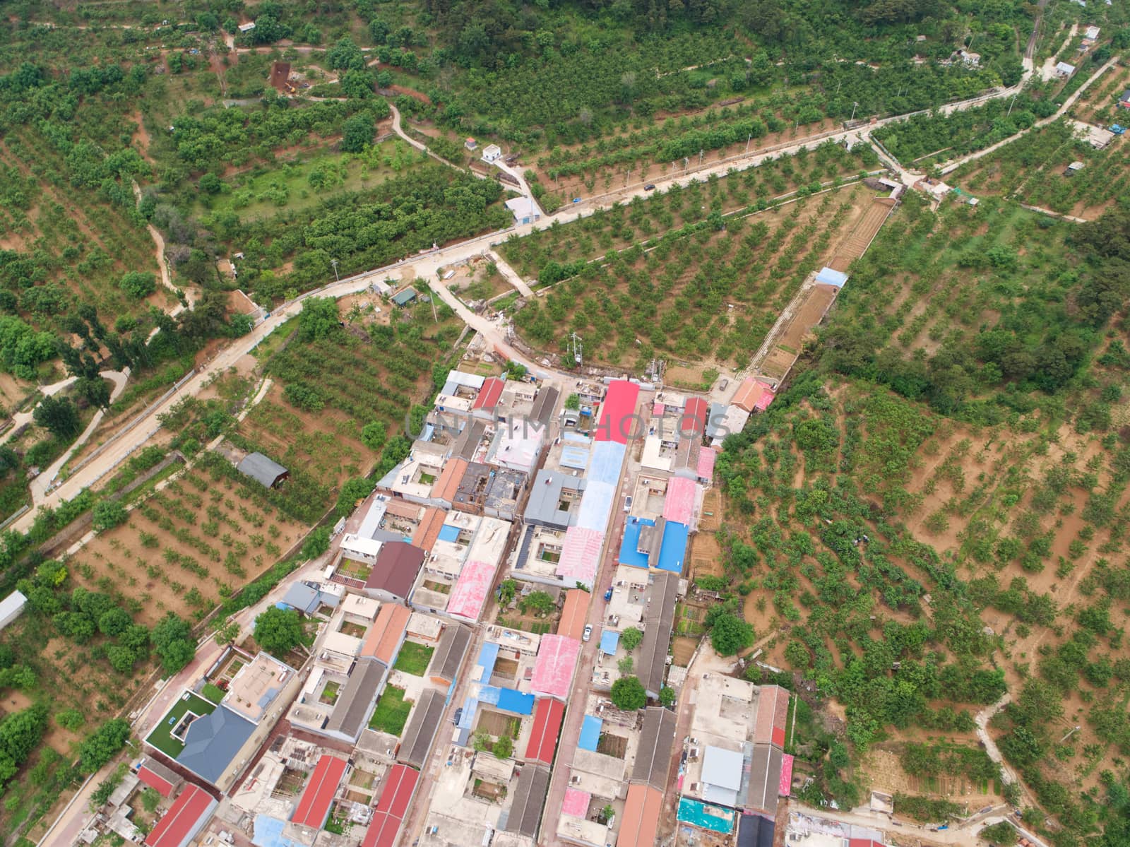 Aerial view top view of small village with little courtyard and farm style house in the country side area of Huaibei next the mountain, China