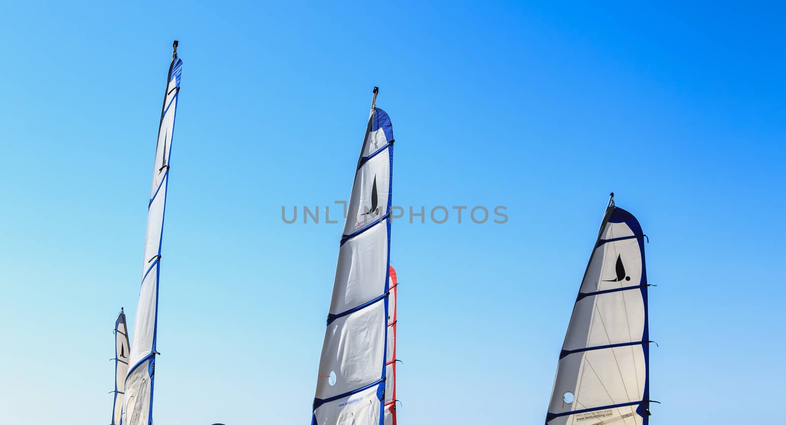 Saint Jean de Monts, France - September 23, 2017 : closeup on sails of sand yacht on blue sky on a summer day