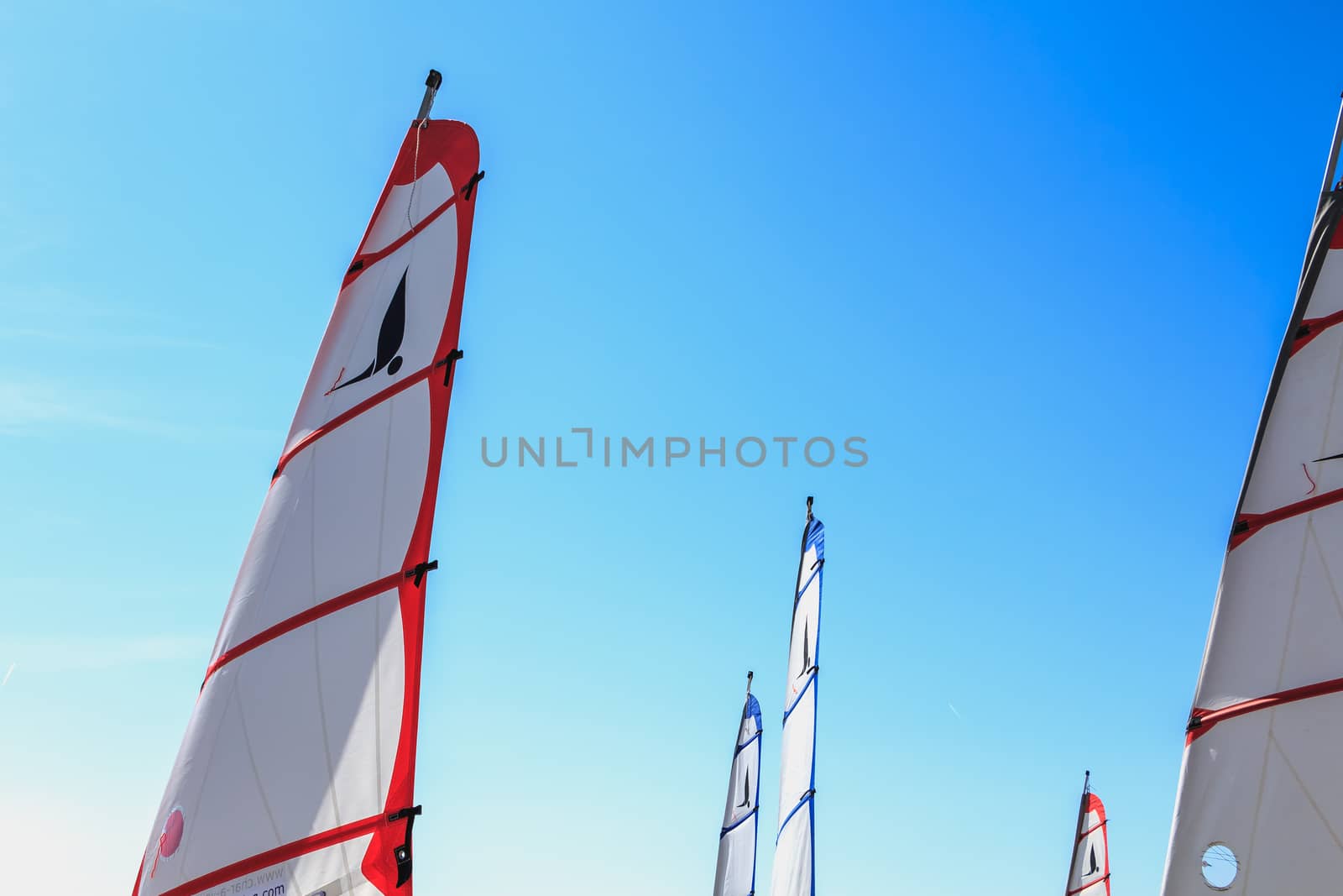 Saint Jean de Monts, France - September 23, 2017 : closeup on sails of sand yacht on blue sky on a summer day