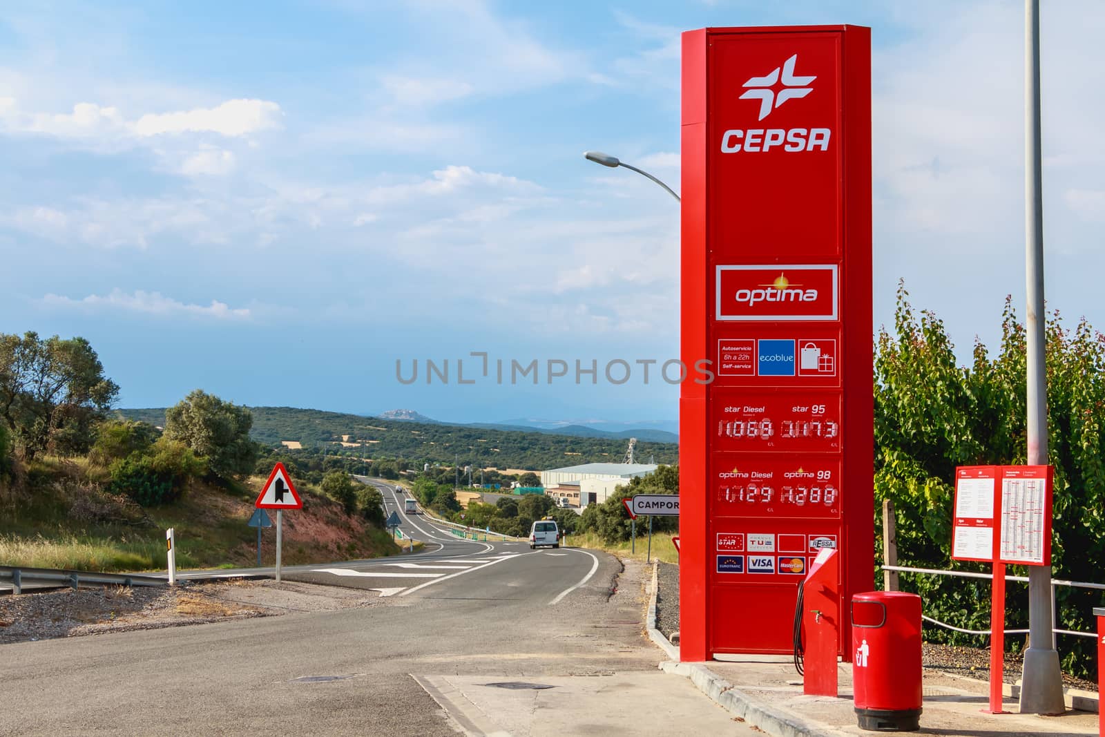Huesca, Spain - June 21, 2017 : detail of a CEPSA gas station on a small country road with its price panels and fuel pumps at the end of the day
