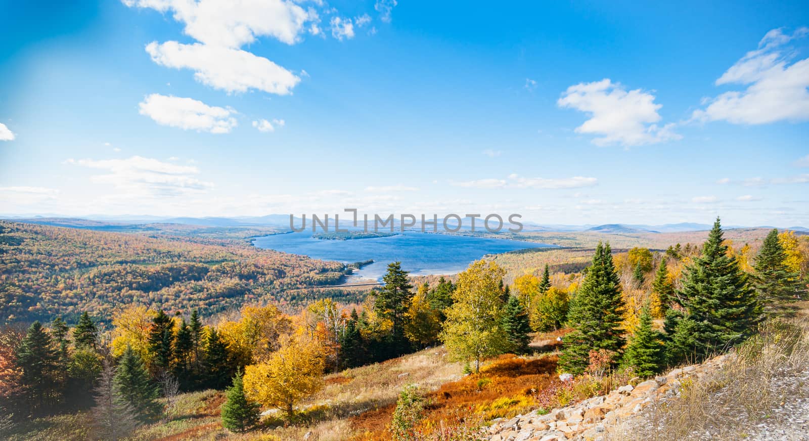 Wide landscape from slopes around picturesque Mooselookmeguntic Lake in Maine USA.