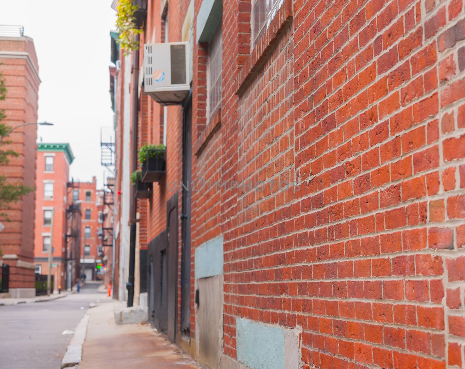 Boston back street background image with focus on foreground and blurry urban beyond, USA.